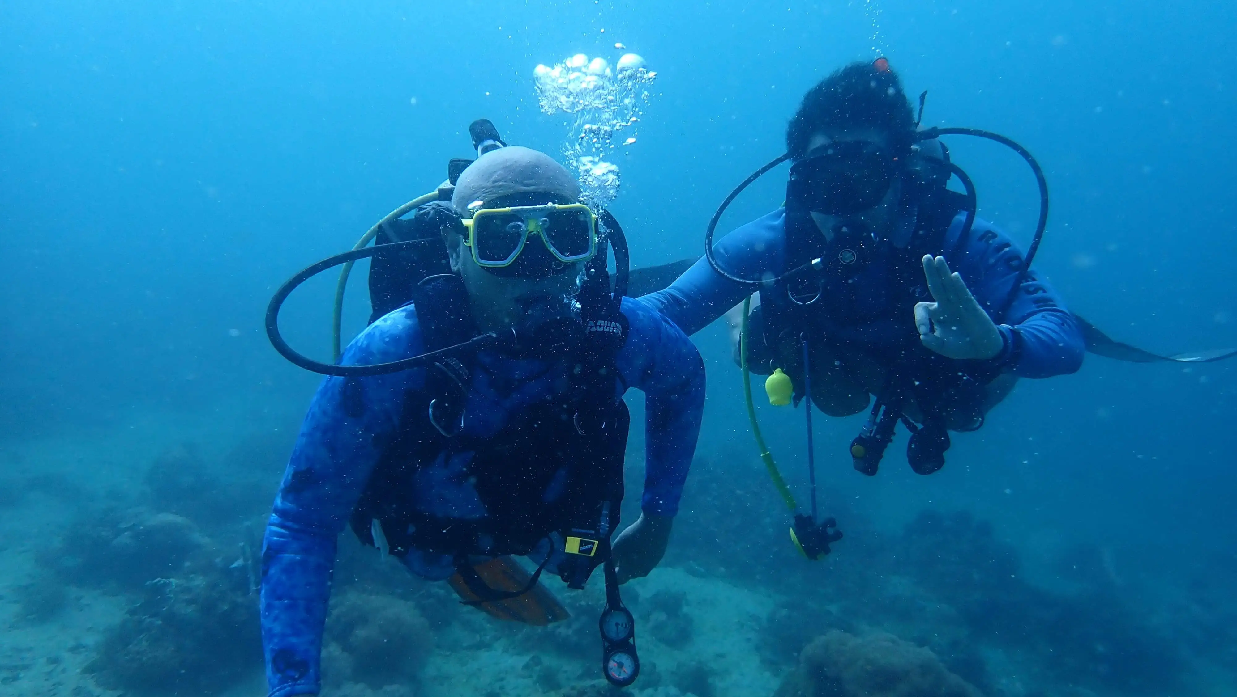 Beginner scuba diver during intro dive in Anilao guided by Rene Camacho